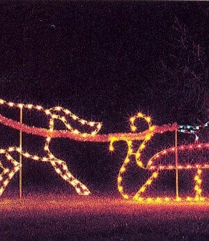Animated holiday display with Santa’s sleigh and moving reindeer lights