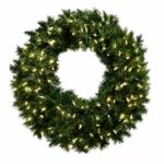 Green Christmas wreath illuminated with warm white lights