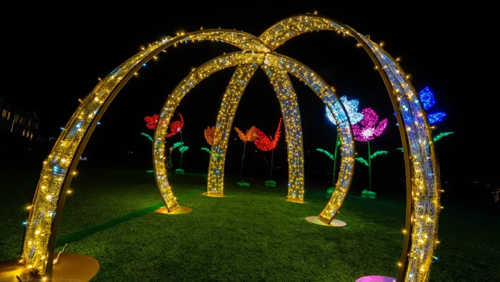 Walk-through Christmas light arches in a commercial holiday display