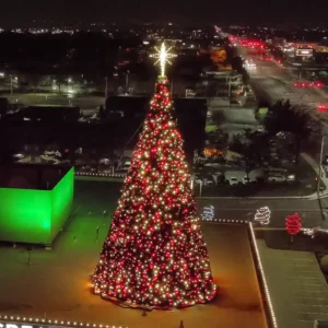 38 ft large commercial Christmas Panel Tree installed outdoors at night
