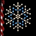 3-foot Star Snowflake pole mount Christmas decoration illuminated with white and blue lights on a pole