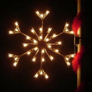 3-foot standard snowflake pole mount holiday light display illuminated on a pole at night