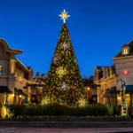 42-foot commercial Christmas panel tree with multicolor lights and snowflake decorations installed in a shopping center