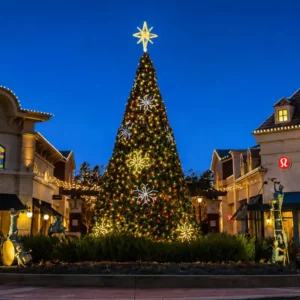 42-foot commercial Christmas panel tree with multicolor lights and snowflake decorations installed in a shopping center