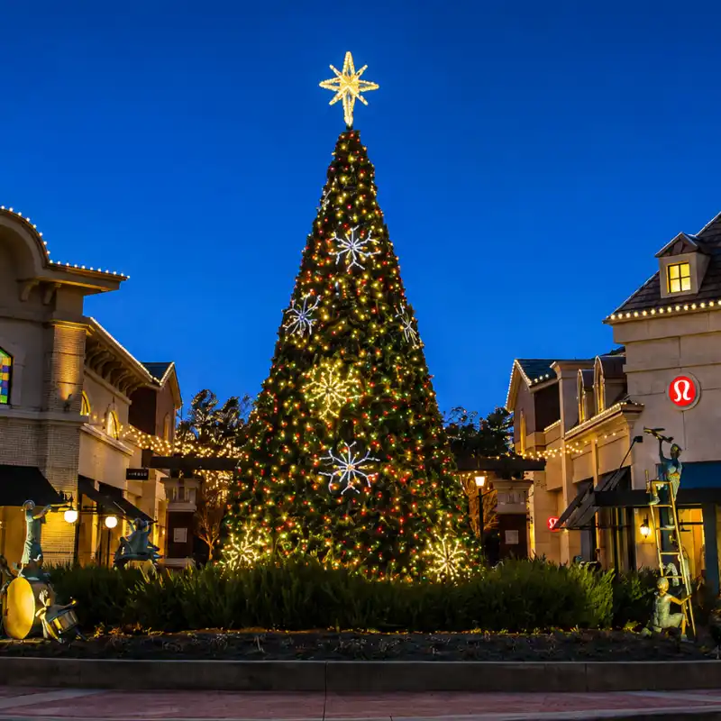 42-foot commercial Christmas panel tree with multicolor lights and snowflake decorations installed in a shopping center