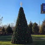 46-foot commercial Christmas panel tree with multicolor decorations installed outdoors in daylight