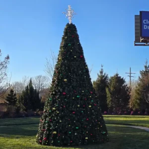 46-foot commercial Christmas panel tree with multicolor decorations installed outdoors in daylight