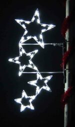 5.5-foot Silhouette Four Falling Stars pole mount Christmas decoration illuminated on a pole