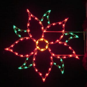 5-foot Silhouette Poinsettia pole mount holiday light display illuminated on a pole at night