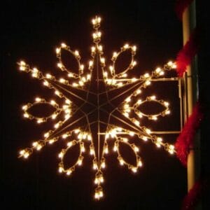 6-foot Silhouette Teardrop Snowflake pole mount Christmas decoration illuminated on a pole at night