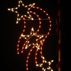 8-foot Falling Stars pole mount holiday light display illuminated on a pole at night