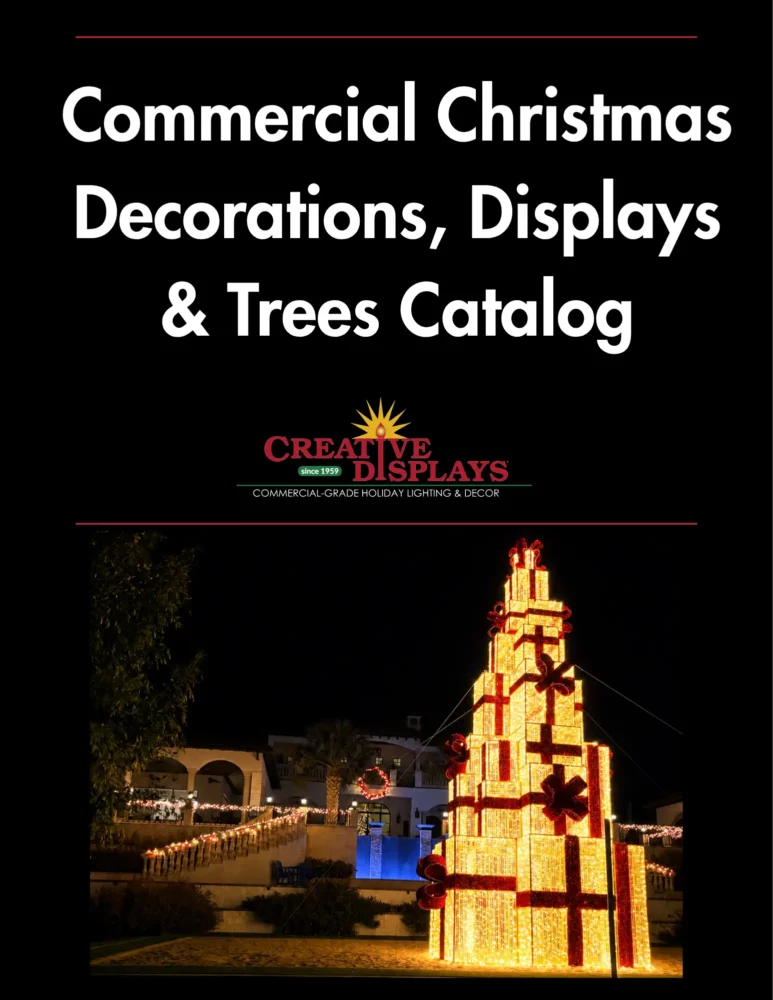 Illuminated gift-box Christmas tree display at night