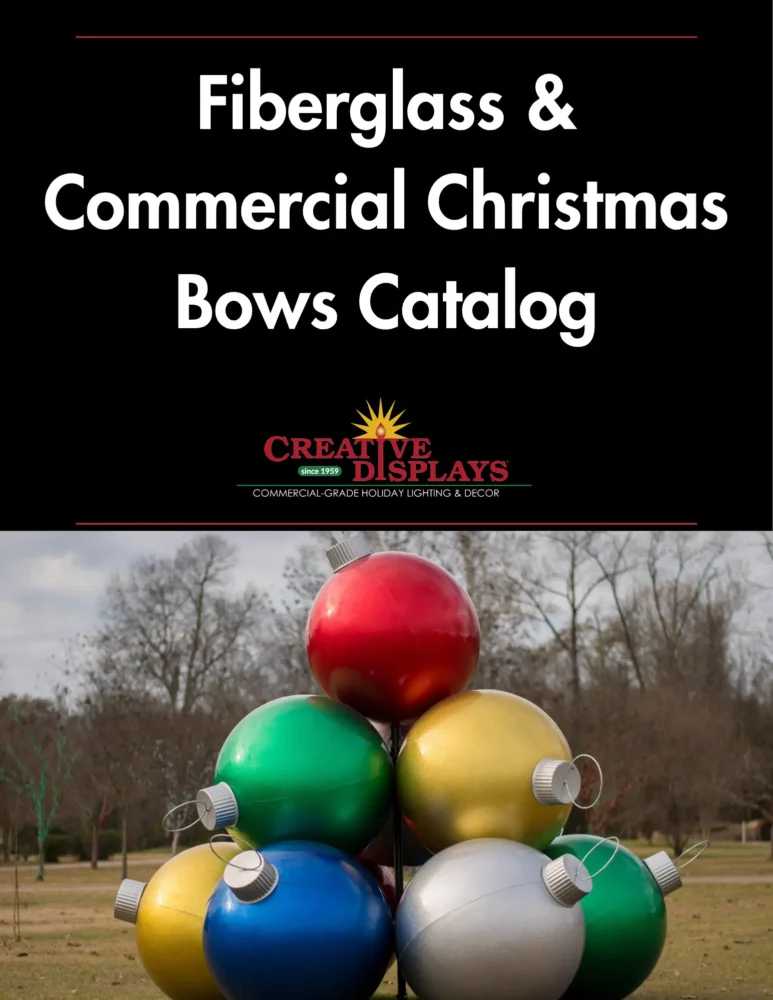 Large colorful fiberglass Christmas ornaments outdoor display
