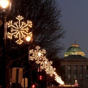 Presidential Snowflake pole mount Christmas decorations installed along a downtown street