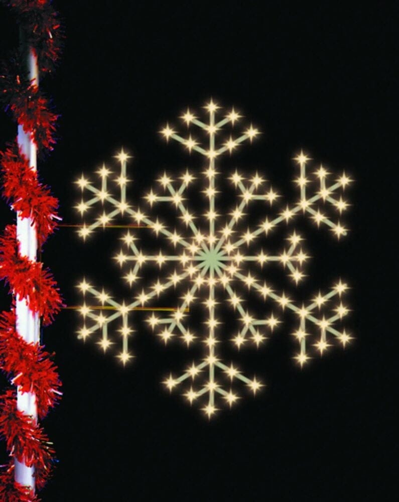 Presidential Snowflake pole mount Christmas light display illuminated at night