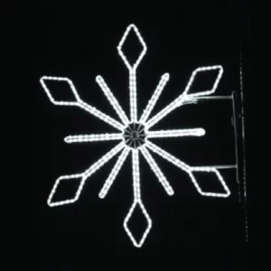 A glowing snowflake shines brightly against the night. Its crisp white lights create a festive winter display.