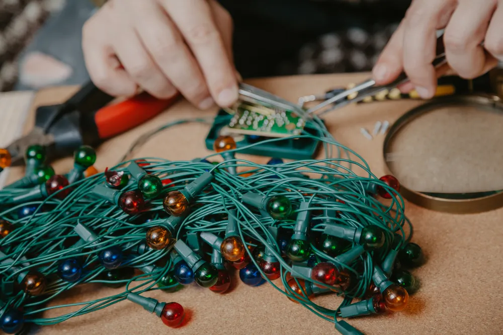 Technician inspecting LED light string