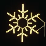 Glowing LED snowflake decoration against black background