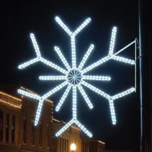 Illuminated snowflake street decoration at night