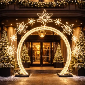 Illuminated holiday arch with snowflakes at hotel entrance