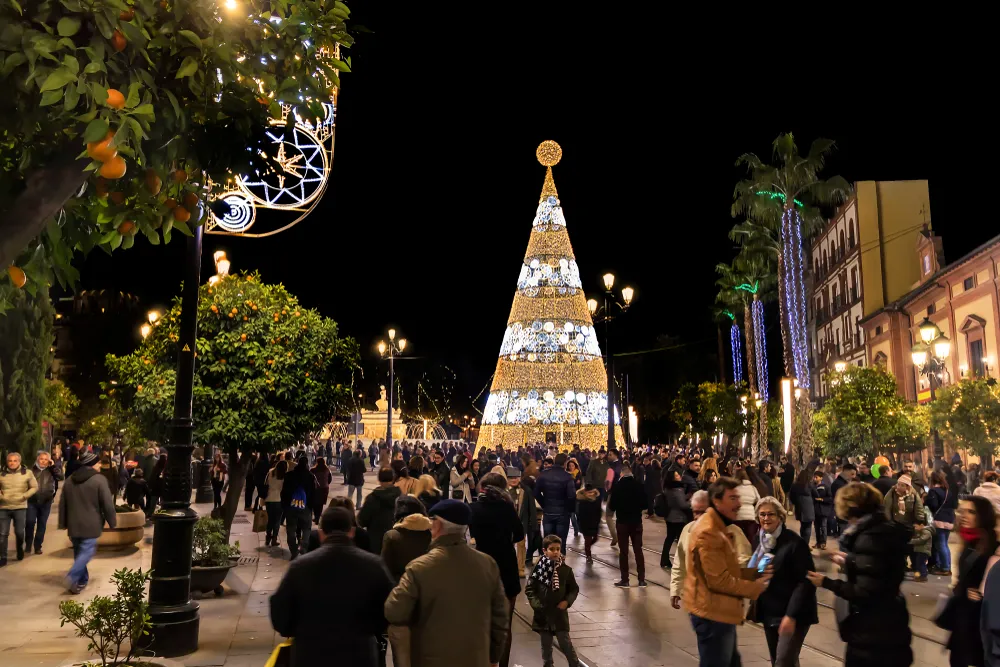 Tourists enjoying Christmas-lit main street