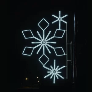 Illuminated snowflake street decoration at night