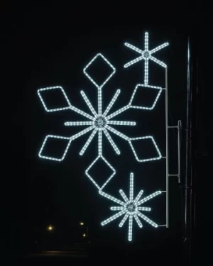 Illuminated snowflake street decoration at night