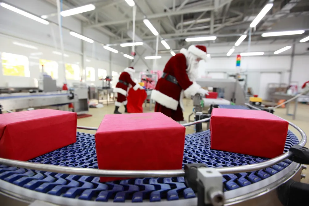 Factory workers assembling LED Christmas lights