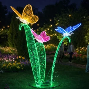 Illuminated butterfly sculptures in a nighttime garden