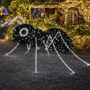 Giant illuminated mosquito decoration in festive garden