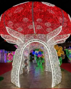 Giant illuminated mushroom light sculpture at night