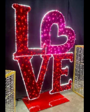 Illuminated LOVE sign with heart-shaped design