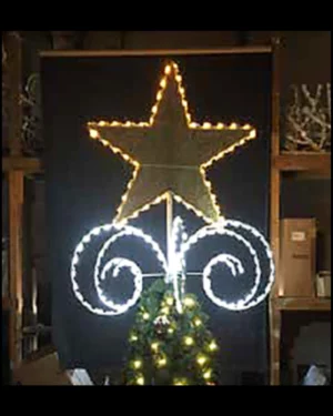 Illuminated star and light display above Christmas tree