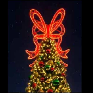 Christmas tree topped with glowing red bow