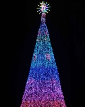 Colorful illuminated Christmas tree with star topper