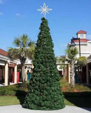 Tall Christmas tree in sunny outdoor plaza