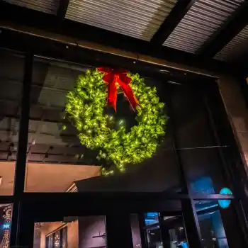 Large illuminated commercial Christmas wreath with red bow