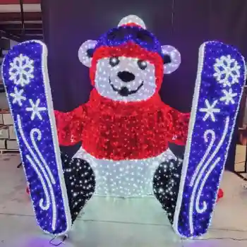 Illuminated polar bear decoration holding blue skis