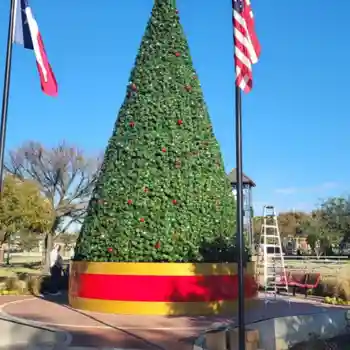Large outdoor Christmas tree with red and gold commercial Christmas tree base