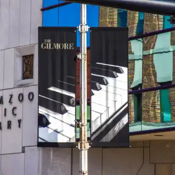 Year Round Commercial Street banners featuring piano keys and The Gilmore logo