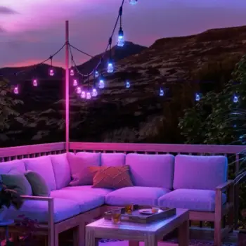 Outdoor patio with glowing commercial patio RGB lighting strings at dusk
