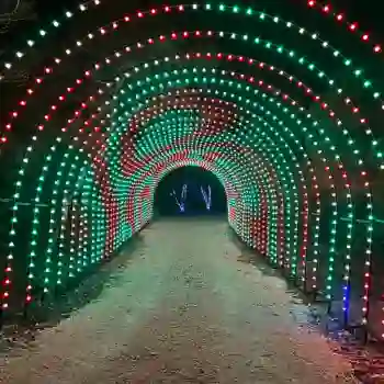 Red and green commercial RGB light tunnel over pathway