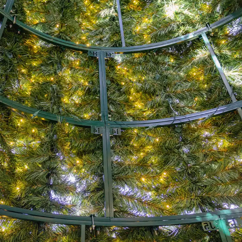 Underside of illuminated artificial Christmas tree structure