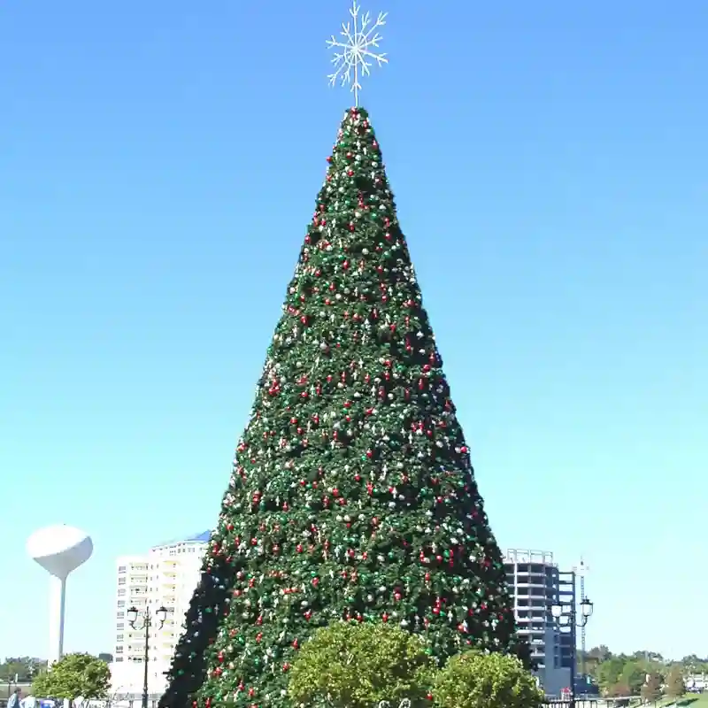 Large outdoor Christmas tree with star topper