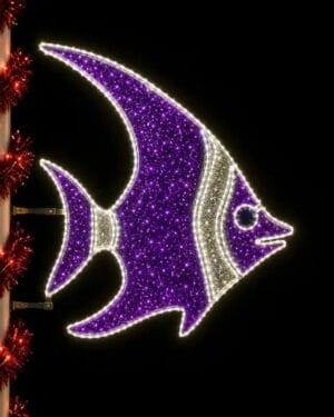 Purple illuminated fish holiday decoration at night