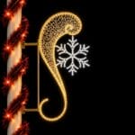 Illuminated street Christmas decorations with snowflake at night
