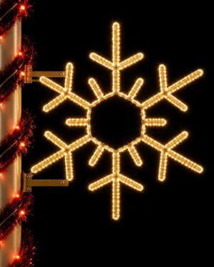 Illuminated snowflake holiday decoration at night