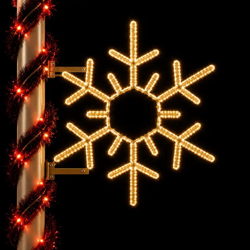 Illuminated snowflake holiday decoration at night