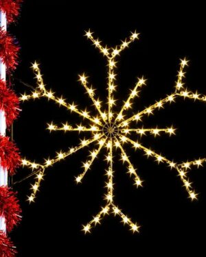 Illuminated snowflake holiday decoration against black background