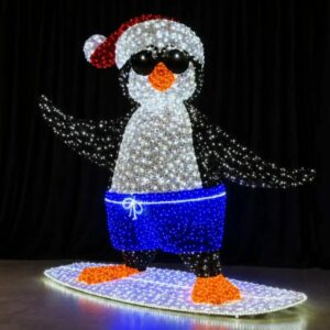 Light-up penguin surfing in Santa hat commercial outdoor Christmas decorations